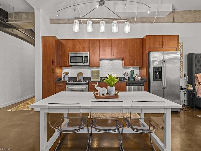 kitchen with decorative backsplash and appliances with stainless steel finishes