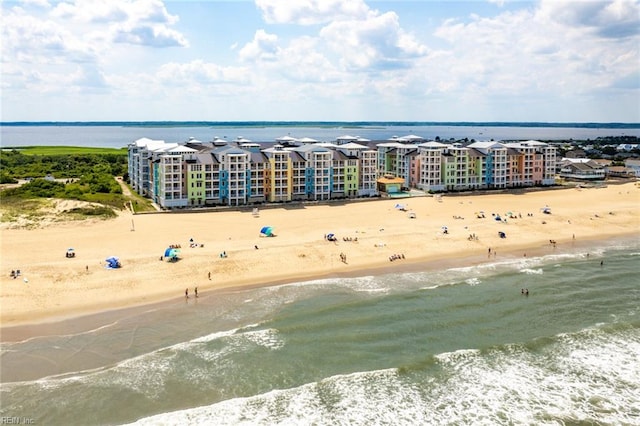 birds eye view of property featuring a view of the beach and a water view