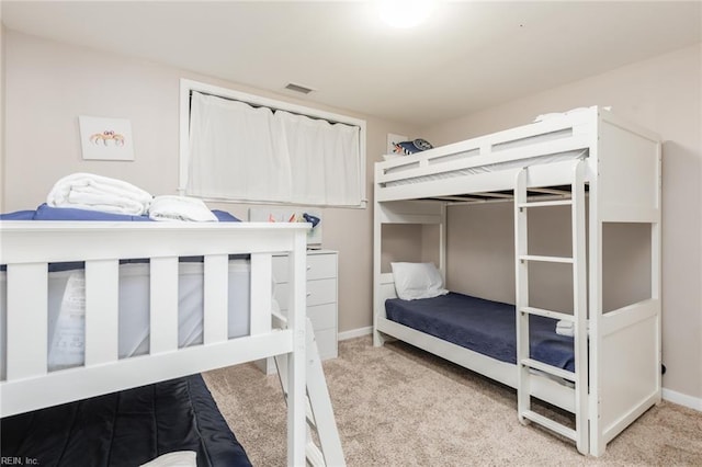 bedroom with light carpet