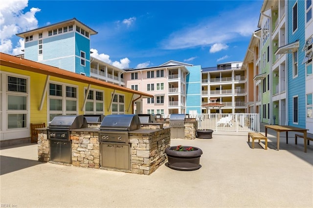 view of patio / terrace featuring an outdoor kitchen and a grill