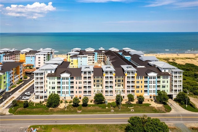 drone / aerial view with a water view and a view of the beach