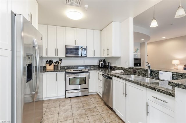 kitchen with white cabinetry, sink, and appliances with stainless steel finishes