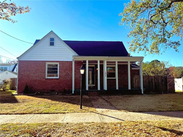 bungalow featuring a porch and a front yard