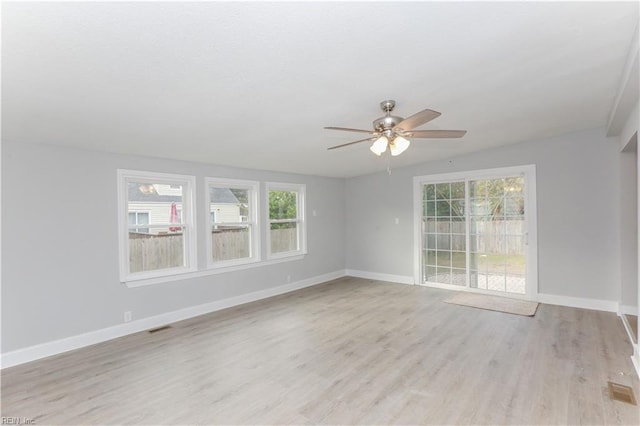 unfurnished room featuring light wood-type flooring and ceiling fan