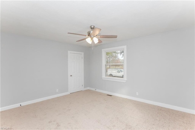 carpeted empty room with ceiling fan