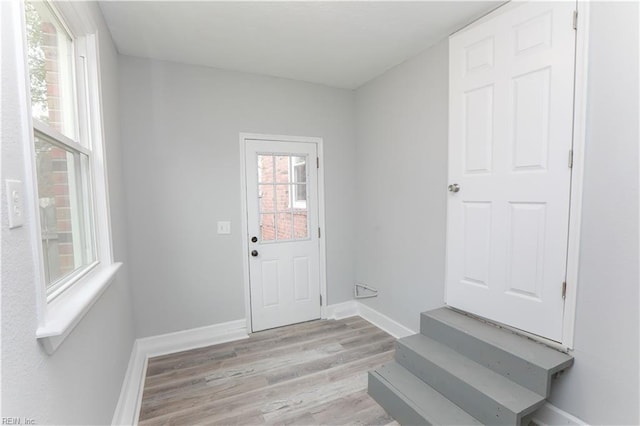 doorway to outside featuring light wood-type flooring