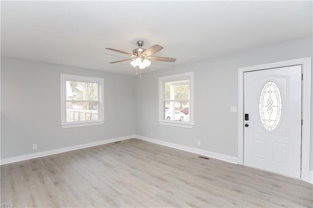 entryway featuring ceiling fan, plenty of natural light, and light hardwood / wood-style floors