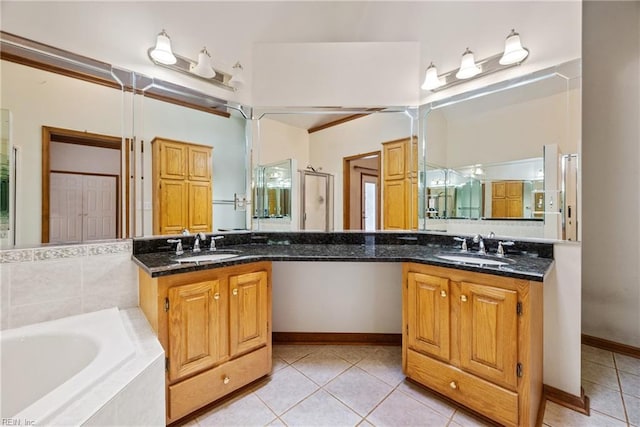 bathroom with plus walk in shower, vanity, and tile patterned flooring