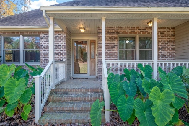 doorway to property featuring covered porch