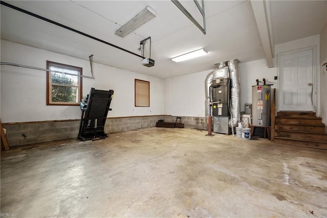 garage with heating unit, a garage door opener, and water heater