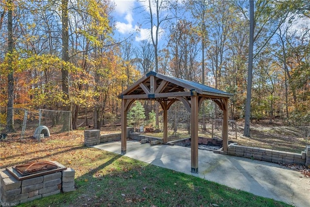 view of property's community with a gazebo and a patio area