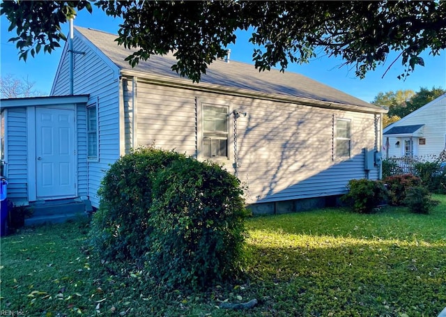 view of home's exterior featuring a yard