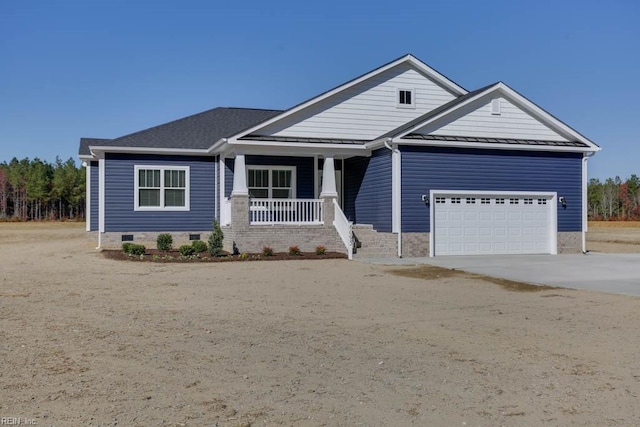 craftsman-style home featuring a porch and a garage