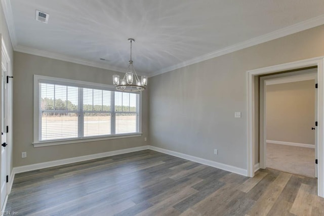 unfurnished room with ornamental molding, a chandelier, and hardwood / wood-style flooring