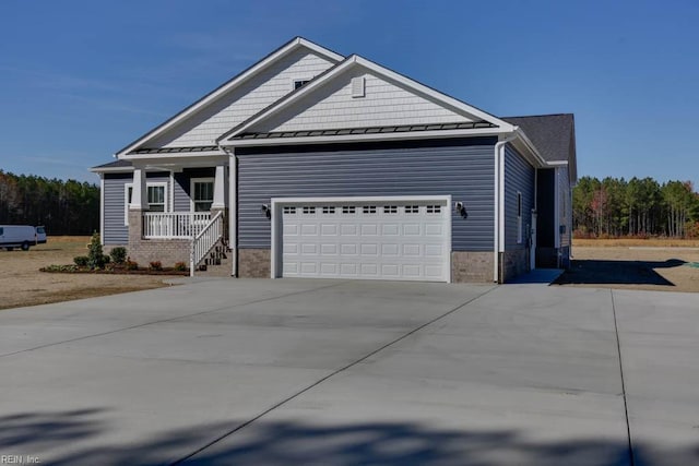 craftsman house with covered porch and a garage