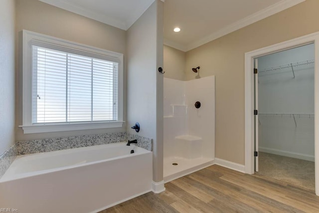 bathroom featuring separate shower and tub, wood-type flooring, and crown molding