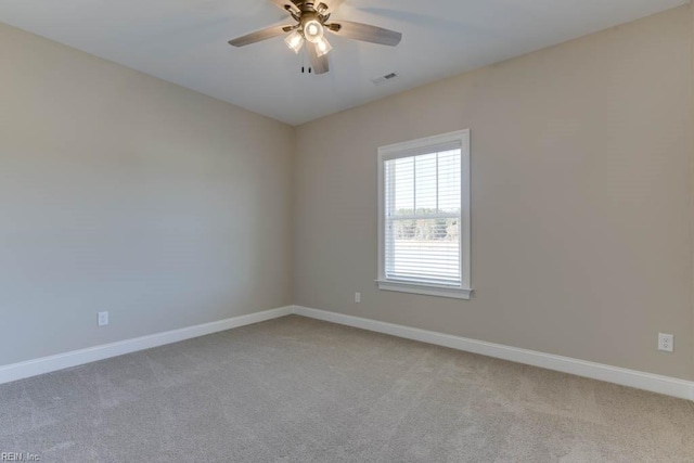 carpeted empty room with ceiling fan