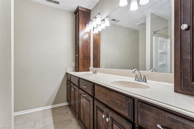 bathroom with vanity and tile patterned floors