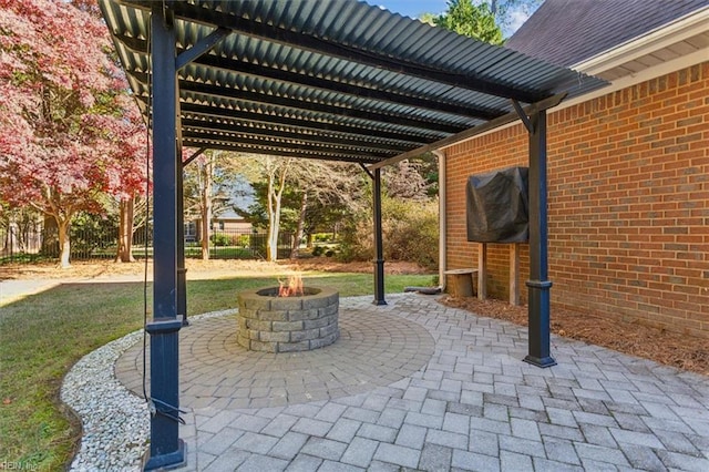 view of patio / terrace with a grill and an outdoor fire pit