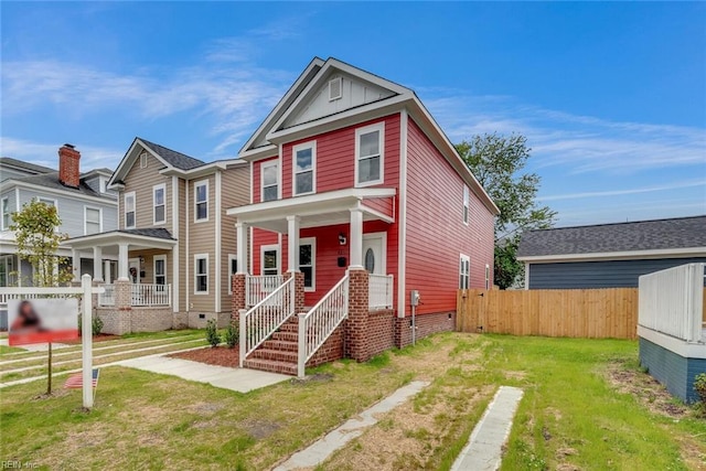 view of front facade featuring a front yard and a porch