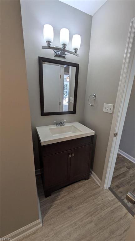 bathroom featuring hardwood / wood-style floors and vanity