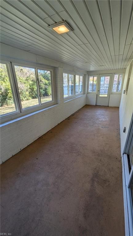 unfurnished sunroom featuring a healthy amount of sunlight