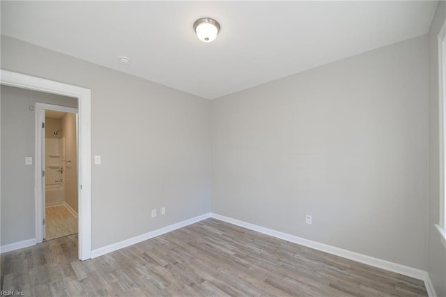 unfurnished room with light hardwood / wood-style floors