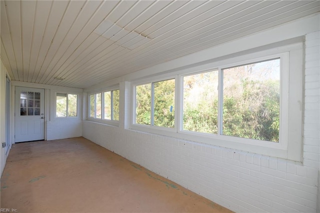 unfurnished sunroom with a wealth of natural light