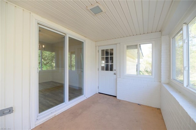 unfurnished sunroom with a wealth of natural light