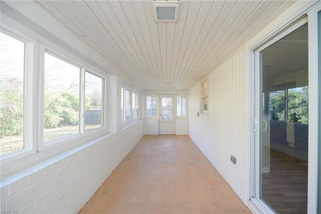 sunroom featuring wooden ceiling