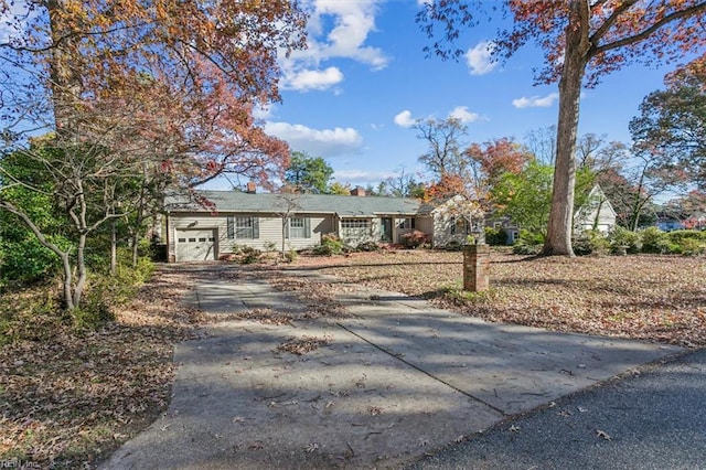 ranch-style house featuring a garage