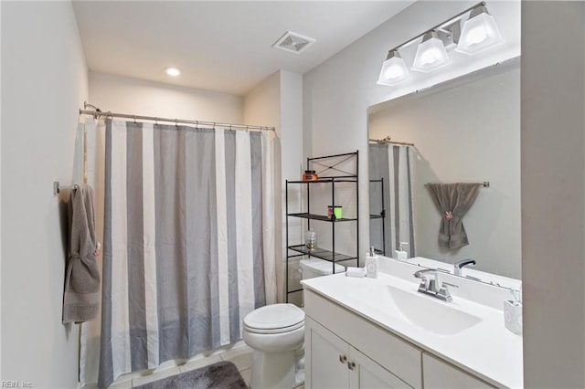 bathroom featuring tile patterned flooring, vanity, toilet, and a shower with shower curtain