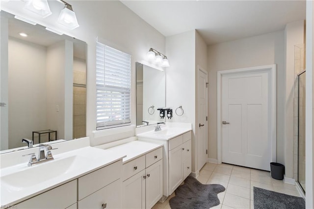 bathroom featuring tile patterned floors, vanity, and an enclosed shower