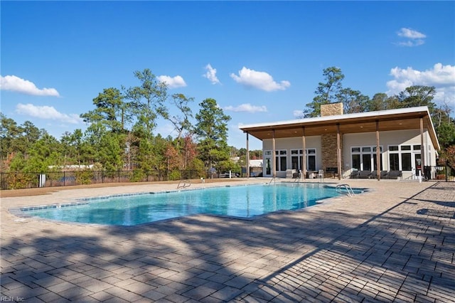 view of swimming pool featuring a patio area