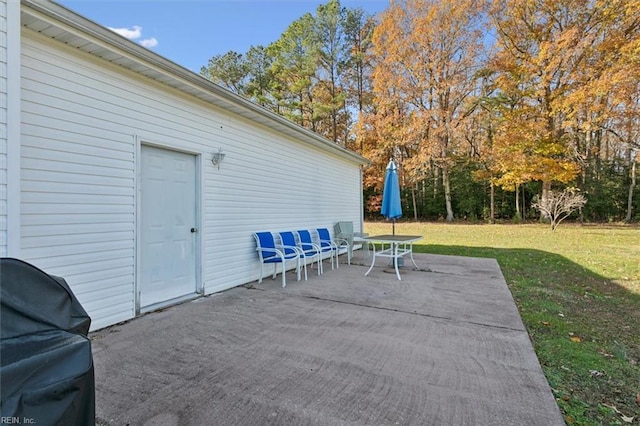 view of patio featuring a grill