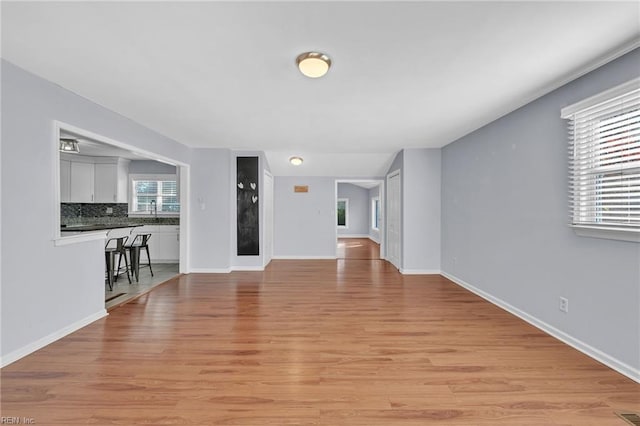 unfurnished living room with light wood-type flooring