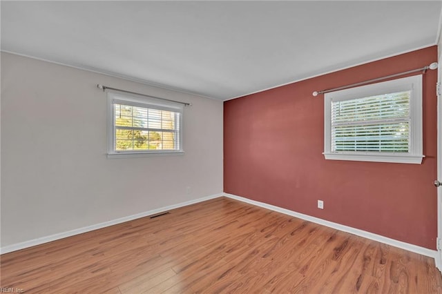 unfurnished room featuring light wood-type flooring