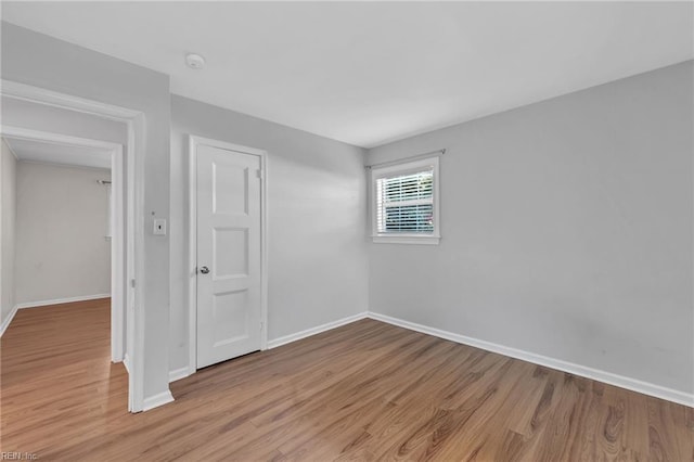 unfurnished room with light hardwood / wood-style floors