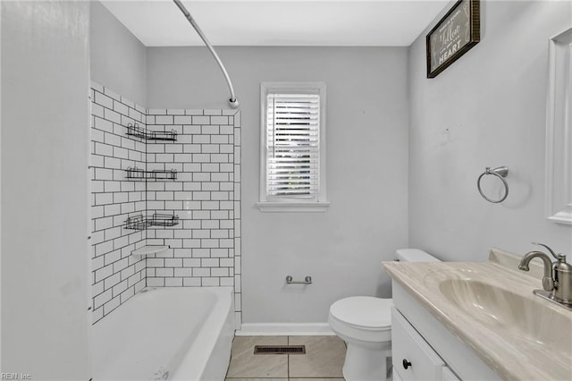 full bathroom with tile patterned floors, vanity, toilet, and tiled shower / bath combo