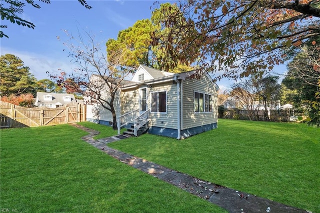 view of property exterior featuring a lawn