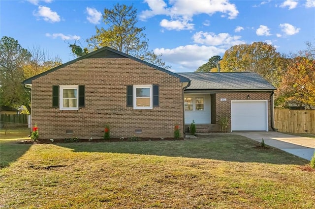 view of front of house with a front yard and a garage