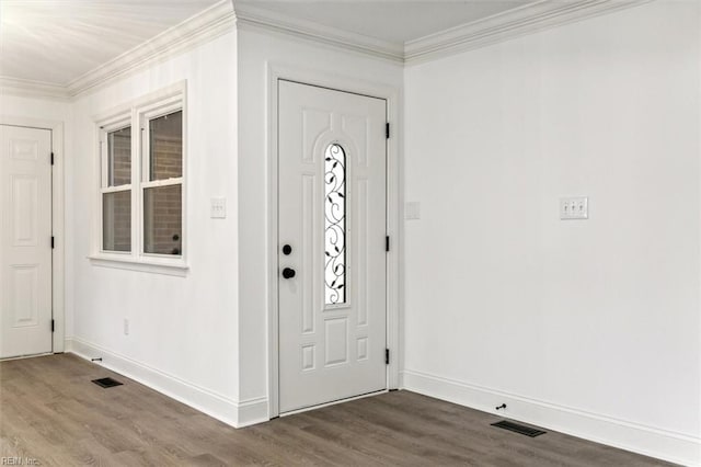 foyer entrance featuring hardwood / wood-style flooring and crown molding