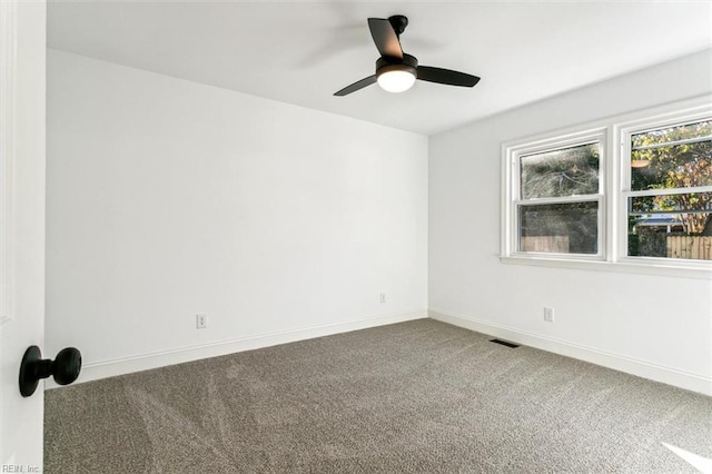 unfurnished room with carpet and ceiling fan