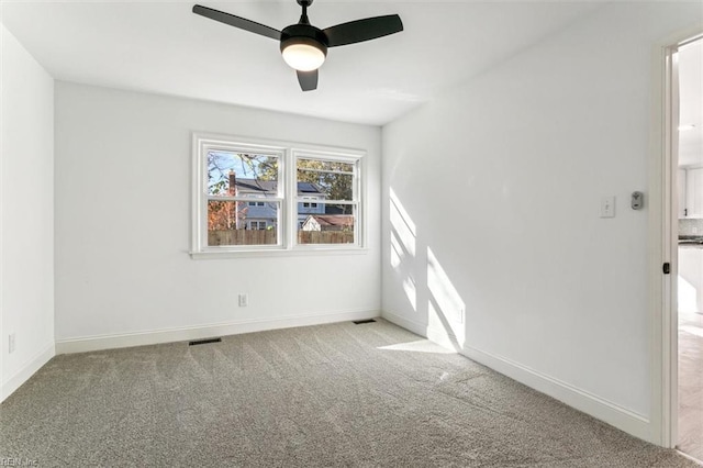 carpeted empty room with ceiling fan