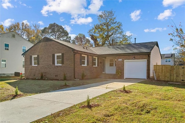 ranch-style home featuring a front yard and a garage