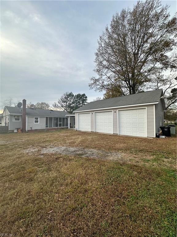 garage with a yard