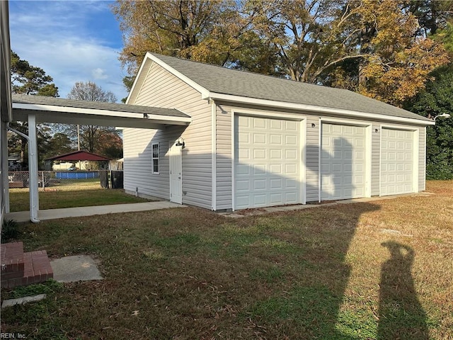 garage with a yard