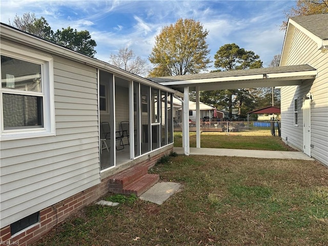 view of yard featuring a sunroom