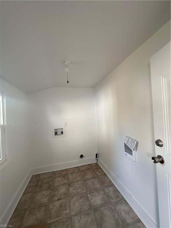 laundry room featuring washer hookup and heating unit