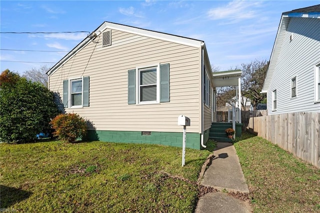 view of home's exterior featuring a yard